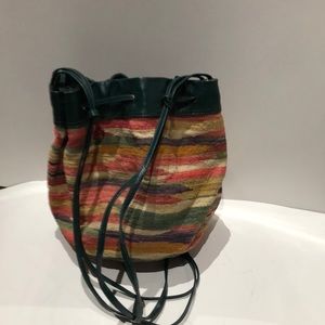 Woven multicolored bag with leather trim
